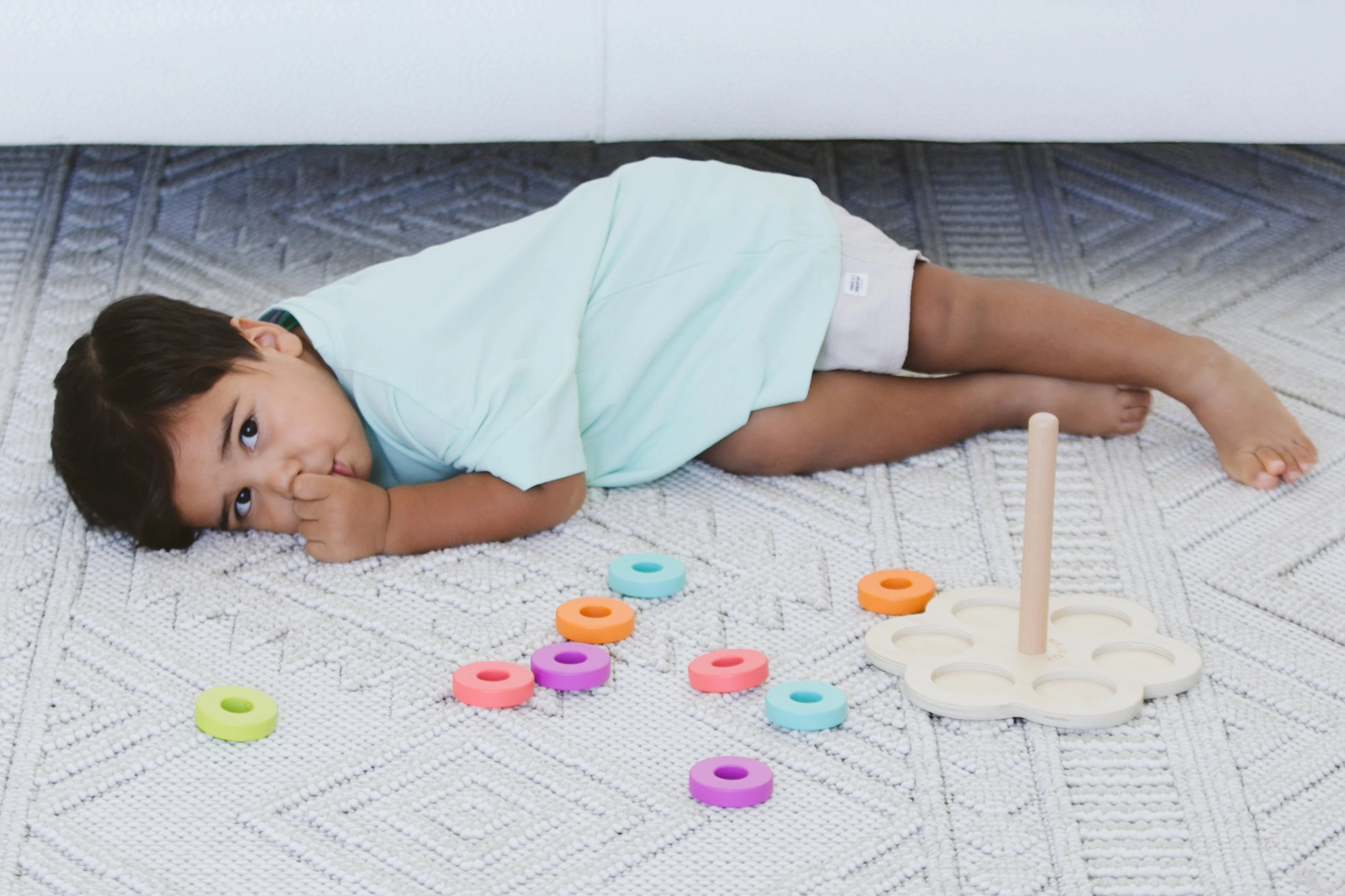 Parent calmly responding and guiding the child towards positive behavior after toddler had aggressive behaviors like kicking and hitting.