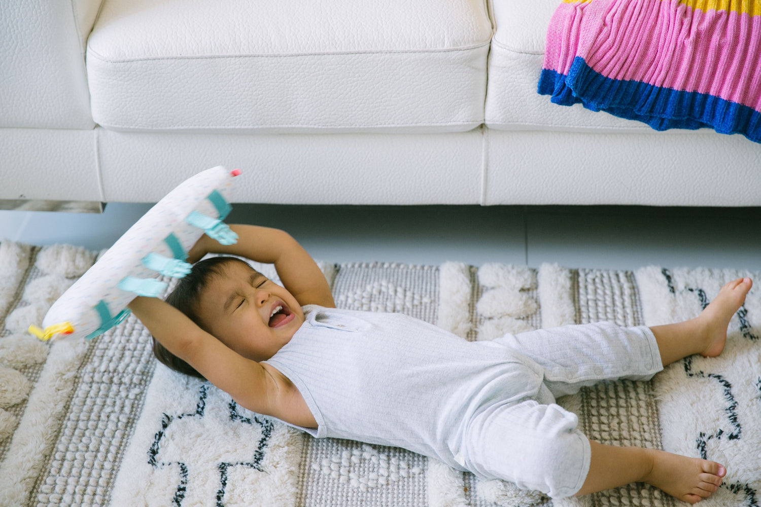 Child having a tantrum, illustrating a challenging behavior moment where redirection and calming strategies can be applied.